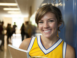 Photo: "USA, Utah, Spanish Fork, Portrait of school girl (16-17) holding notepad in corridor" "USA, Utah, Spanish Fork, Portrait of school girl (16-17) holding notepad in corridor"