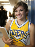 Photo: "USA, Utah, Spanish Fork, Portrait of school girl (16-17) holding notepad in corridor" "USA, Utah, Spanish Fork, Portrait of school girl (16-17) holding notepad in corridor"