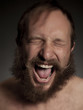 Young man with beard shouting