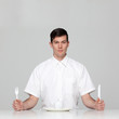 Studio portrait of young man waiting for meal