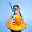 Studio shot of girl (10-11) with snorkeling gear and inflatable ring
