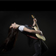 Studio shot of teenage girl (14-15) playing electric guitar