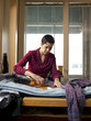 "USA, Utah, Provo, Young female tailor at work"