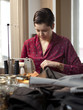 "USA, Utah, Provo, Young female tailor at work"