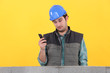 Worker behind wall