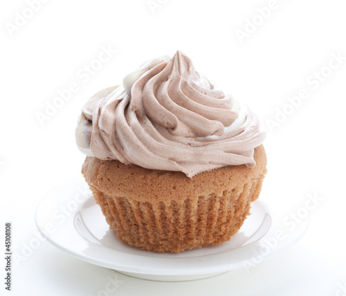 Photo: Eatable cupcake with mouse cream isolated Eatable cupcake with mouse cream isolated