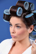 Woman wearing hair curlers