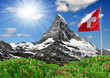 Beautiful mountain Matterhorn with Swiss flag - Swiss Alps