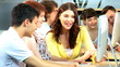 Video: Young students working on computers with teacher in hub Young students working on computers with teacher in hub