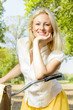 happy young woman on the bicycle