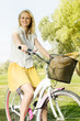 happy young woman on the bicycle