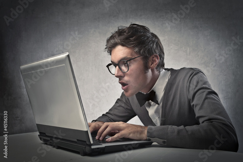 Photo: Fashionable Man on the Computer Fashionable Man on the Computer