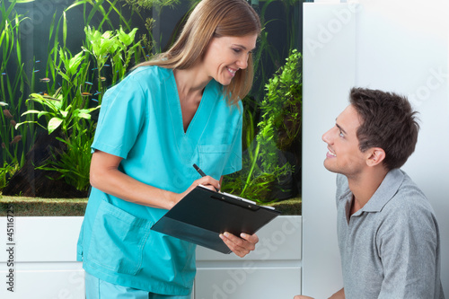 Photo: Dentist Taking An Appointment Of Man Dentist Taking An Appointment Of Man