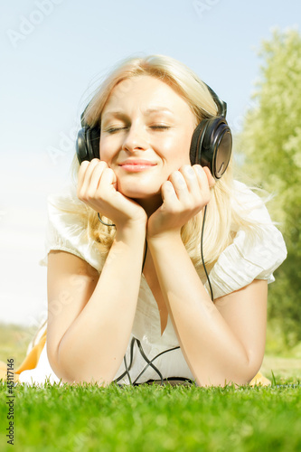 Photo: happiness smiling blonde woman relaxing happiness smiling blonde woman relaxing
