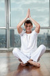 Young Man Practicing Yoga At Gym