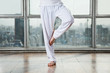 Man Practicing Yoga In Tree Pose
