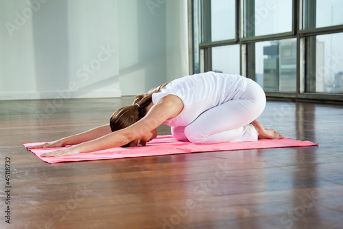 Photo: Young Woman Practicing Yoga Young Woman Practicing Yoga