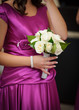 Bridesmaid with bouquet at wedding ceremony