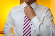 Groom fixing tie