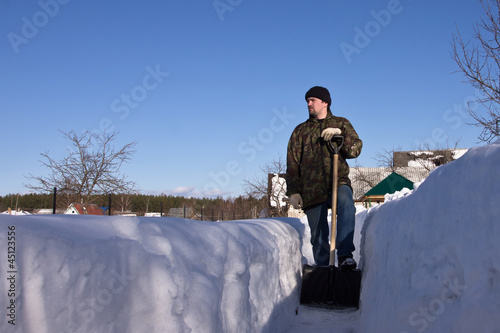 Photo: Man with a snow shovel Man with a snow shovel