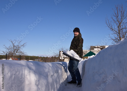Photo: Man with a snow shovel Man with a snow shovel