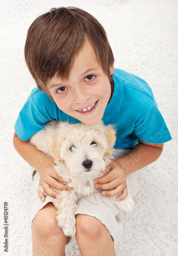 Photo: Young boy with his doggy Young boy with his doggy