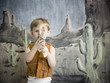 little boy pretending to be cowboy