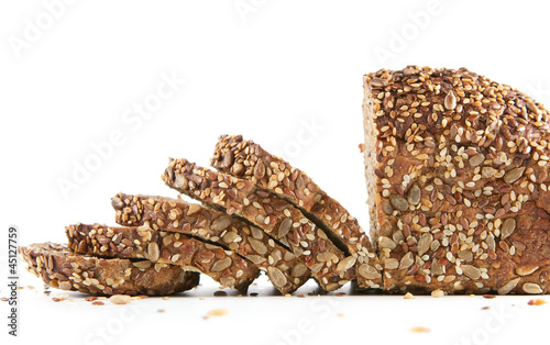 Photo: Fresh sliced homemade bread isolated on white background Fresh sliced homemade bread isolated on white background