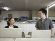 man and woman at a laundromat