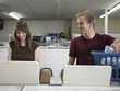 man and woman at a laundromat