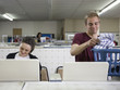 man and woman at a laundromat