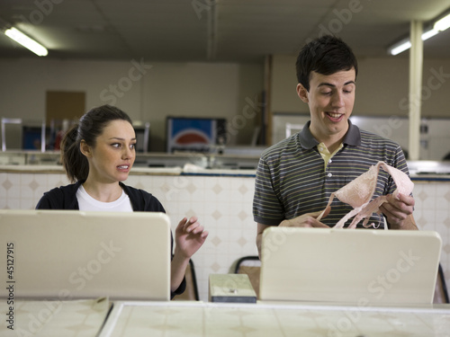 Photo: man and woman at a laundromat man and woman at a laundromat