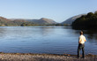 Hiker at Grasmere at dawn in Lake District
