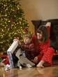 mother and son opening a christmas present