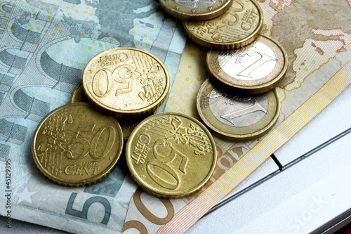 Photo: Euro banknotes and coins Euro banknotes and coins
