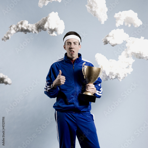 Photo: jogger holding a trophy jogger holding a trophy