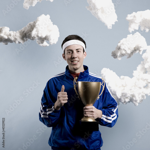 Photo: jogger holding a trophy jogger holding a trophy