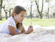 girl lying on a blanket