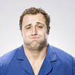 man in his pajamas about to throw up