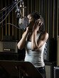 singing in a recording studio