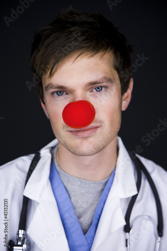 Photo: doctor wearing a red clown nose doctor wearing a red clown nose