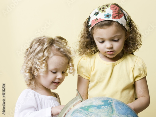 Photo: little girls with globe little girls with globe
