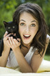 "USA, Utah, Orem, Portrait of woman holding kitten"