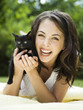 "USA, Utah, Orem, Portrait of woman holding kitten"