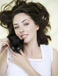 Portrait of woman holding kitten