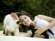 "USA, Utah, Orem, Portrait of woman playing with cats"