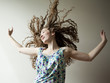 Studio shot of young woman dancing