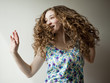 Studio shot of young woman dancing