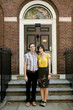 "USA, New York, New York City, Portrait of young couple in front of apartment building"
