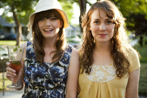 Photo: "USA, Utah, Orem, Portrait of two women smiling" "USA, Utah, Orem, Portrait of two women smiling"